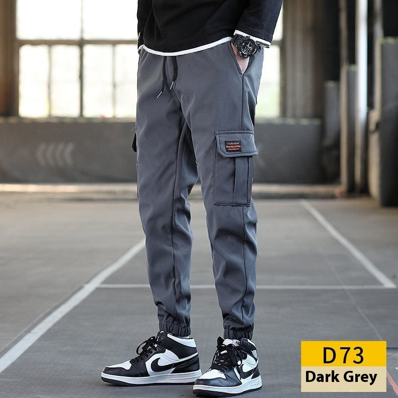 بنطال عمل رجالي فضفاض متعدد الجيوب مقاوم للتآكل بلون موحد وحزام للكاحل، مناسب لجميع الإطلالات